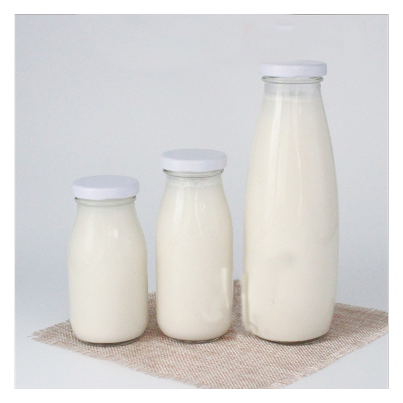 Venta caliente al por mayor 200 ml 500ml 1000ml botellas de bebidas de leche redonda de vidrio