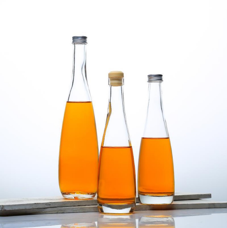 Botellas de vidrio de alta calidad para envases de bebidas de vidrio de agua mineral