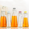 Botellas de bebidas de jugo de leche de vidrio con tapas de mango selladas 500 ml 1000ml