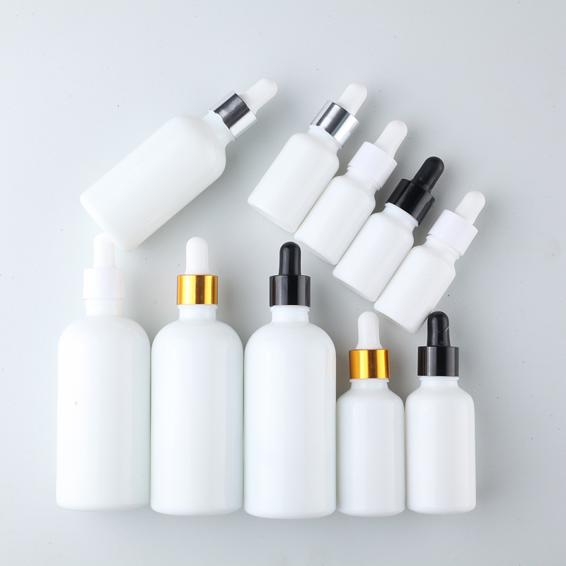 Bottillas de gotero de vidrio de impresión personalizada de color blanco para cosméticos 