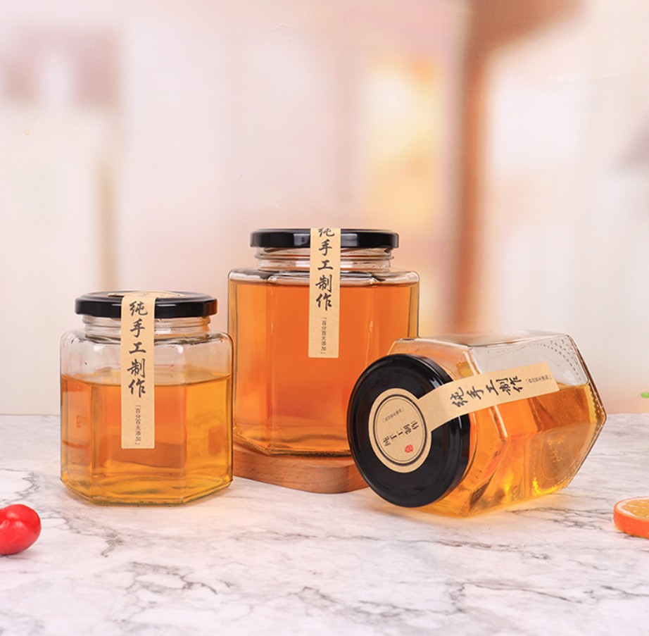 Botella de pepinillo de vidrio de almacenamiento de alimentos personalizados al por mayor 45ml/60ml/85ml/100ml/180ml/280ml/380ml/500ml/730ml Jares de vidrio para miel